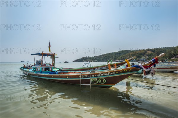Colourful long-tail boats in sea