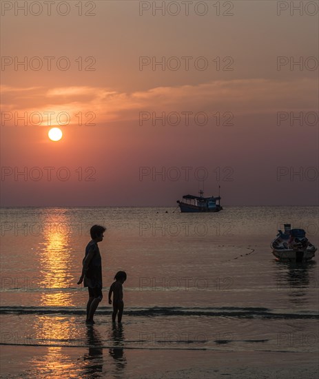 Woman and child in water