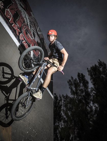 Teenager with BMX bike at skate park