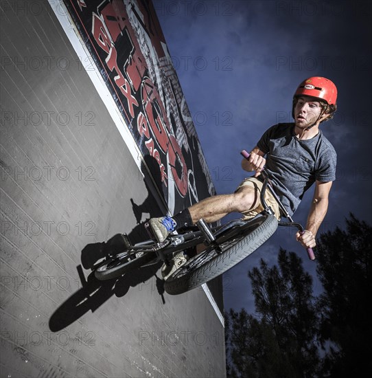 Teenager with BMX bike at skate park