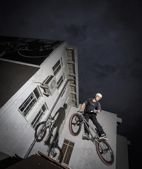 Teenager with BMX bike at skate park