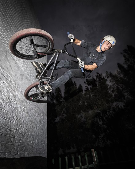 Teenager with BMX bike at skate park