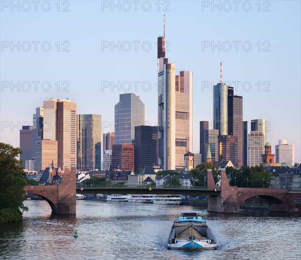 Old bridge over the Main and skyscrapers in the financial district in the morning light