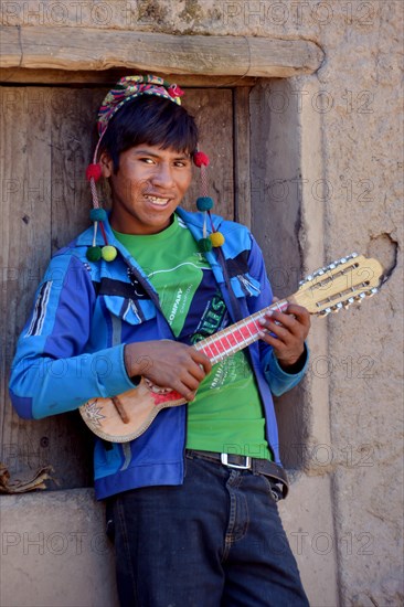 Student playing ukulele at boarding school