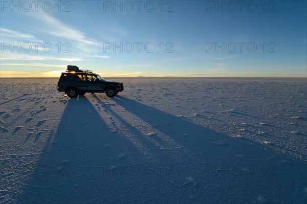 SUV shadow on salt flat
