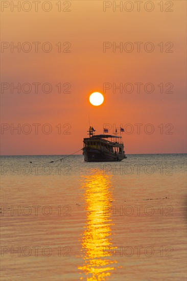 Boat in the sea at sunset