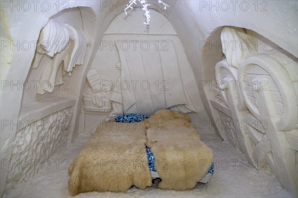 Bedroom with wall relief in the ice hotel