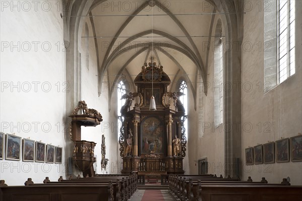 Interior with Baroque high altar and pulpit of the former monastery Kreuzthal-Maria Burghausen