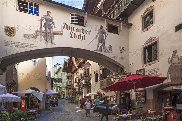 View into an alley of the the historic centre with a restaurant