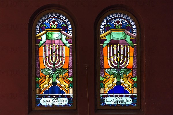 Coloured stained glass windows with seven-armed chandelier