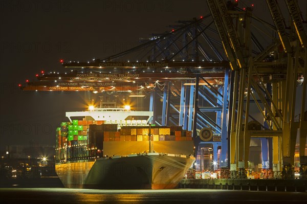 Container ship at the container terminal Tollerort at night
