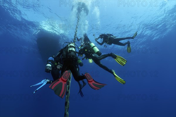 Group of divers after deep dive