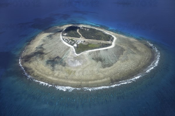 Fringing reef around small island with runway