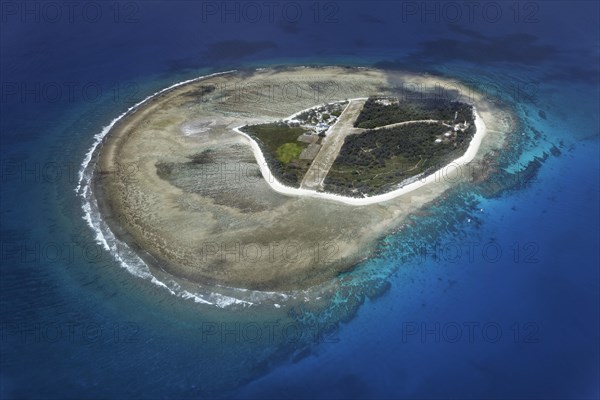 Fringing reef around small island with runway