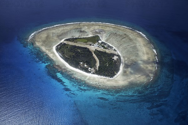 Fringing reef around small island with runway