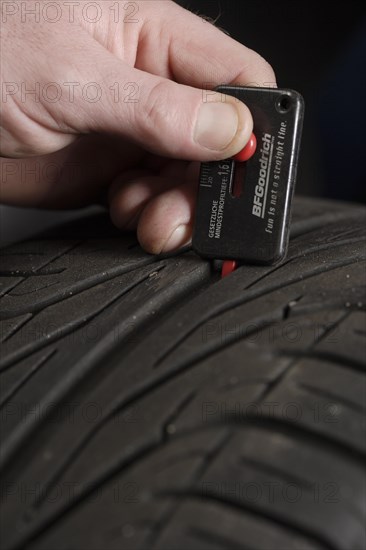 Measuring a car tire's tread depth