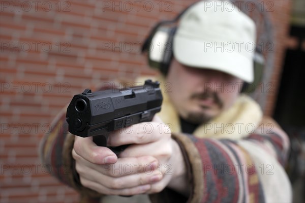 Shooter with Walther P99 at the ready
