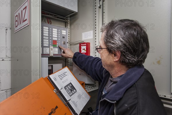 Caretaker servicing the central fire alarm system