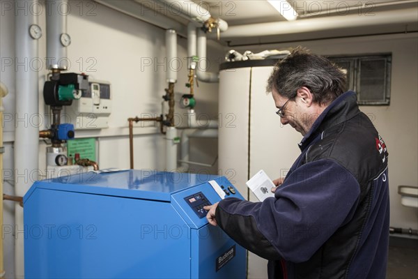 Caretaker checking heating system