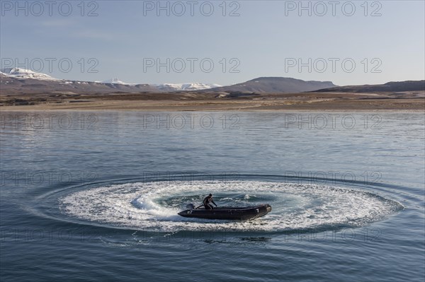 Guide in a Zodiac inflatable boat