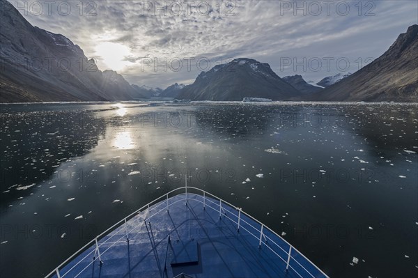 Expedition ship sailing through ice floes