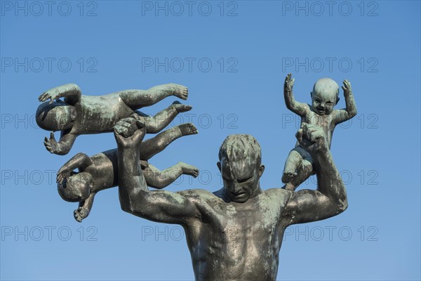 Man with three small children