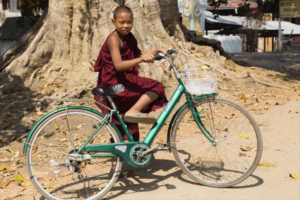 Monk on a bicycle at the Five-Day Market