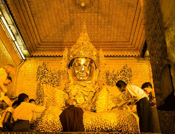 Buddha covered with small gold leaves