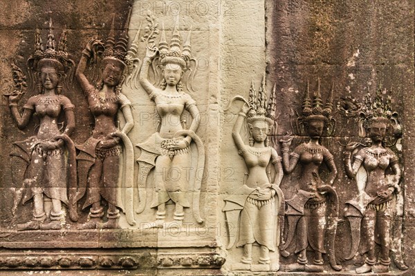 Bas-reliefs of devis on the walls of Angkor Wat