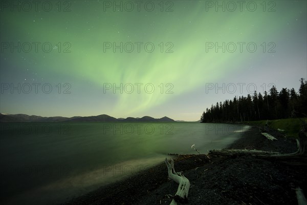 Aurora borealis and moonlight over Prince William Sound