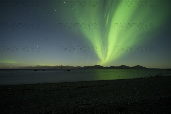 Aurora borealis and moonlight over Prince William Sound