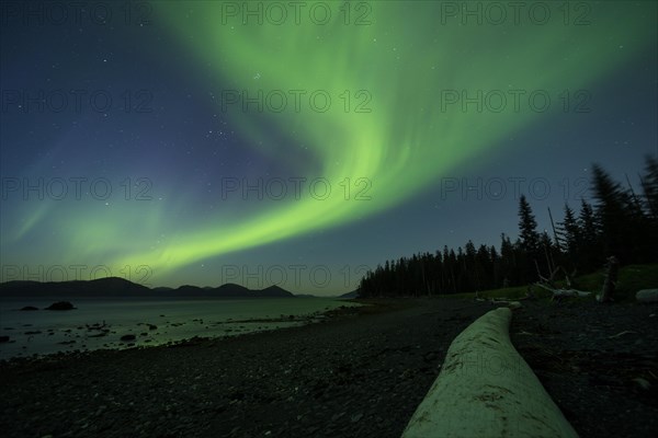 Aurora borealis and moonlight over Prince William Sound