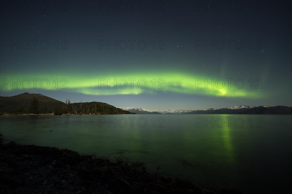 Aurora borealis and moonlight over Prince William Sound