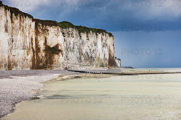 Storm clouds over chalk cliffs on the coast near Saint-Valery-en-Caux