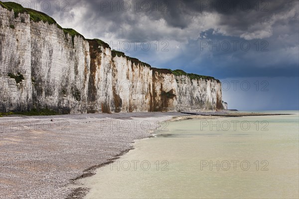 Storm clouds over chalk cliffs on the coast near Saint-Valery-en-Caux