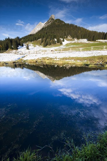 Walderkamp peak and Hundskopf reflected in a small lake