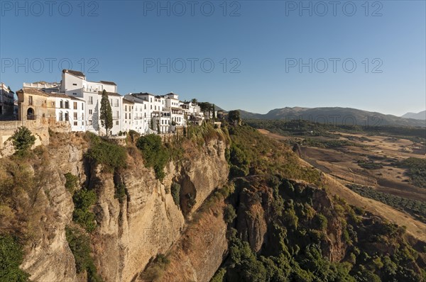 Whitewashed houses atop El Tajo Gorge Canyon