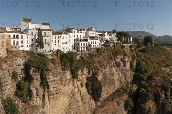 Whitewashed houses atop El Tajo Gorge Canyon