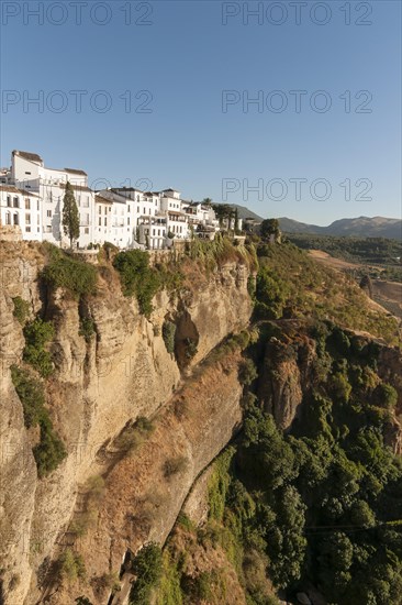 Whitewashed houses atop El Tajo Gorge Canyon