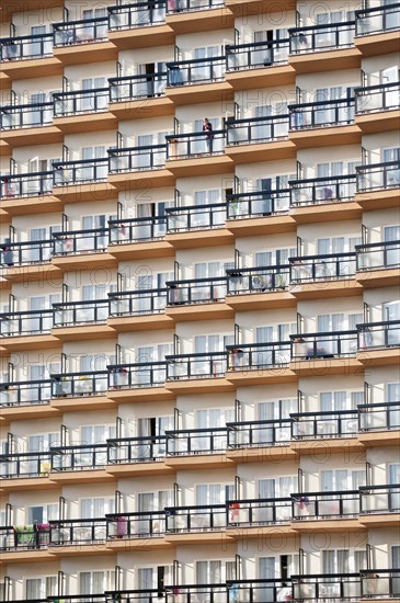 Rows of balconies on the facade of a large hotel complex in Torremolinos