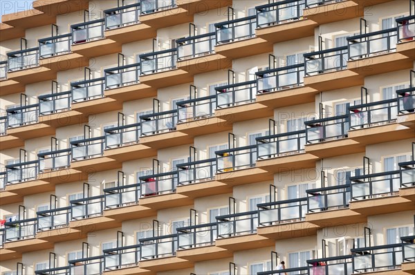 Rows of balconies on the facade of a large hotel complex in Torremolinos