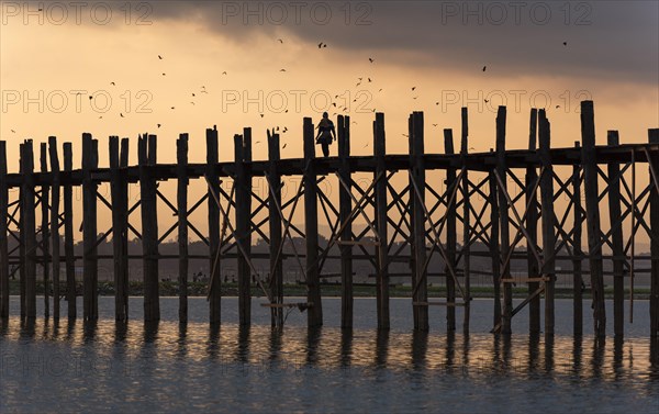 Sunrise over the U Bein Bridge crossing the Taungthaman Lake