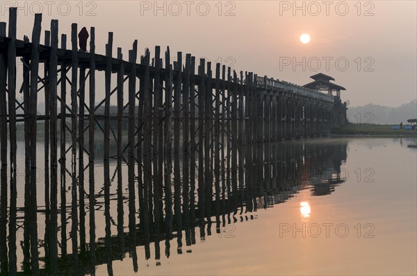 Sunrise over the U Bein Bridge crossing the Taungthaman Lake