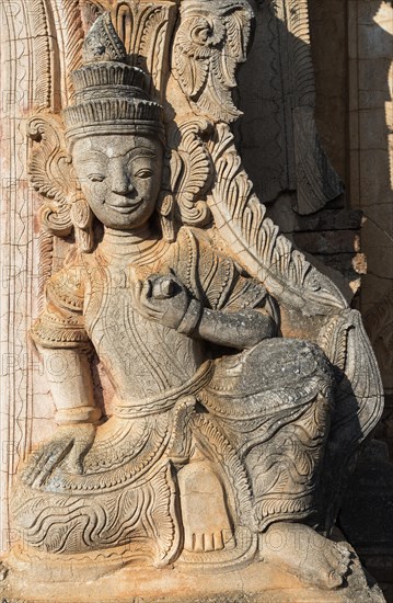 Deva statue at the crumbling Nyaung Oak monastery in Inthein