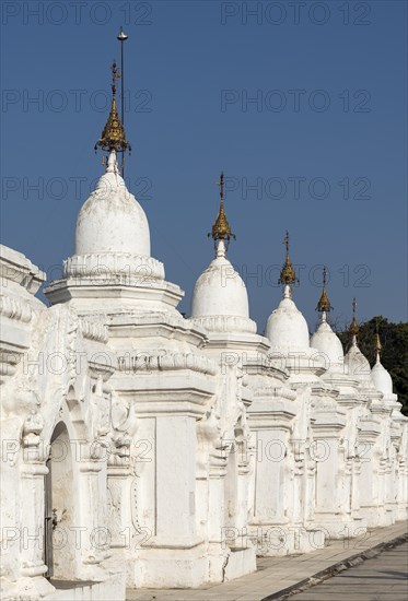 Row of whitewashed stone-inscription caves at Kuthodaw Pagoda