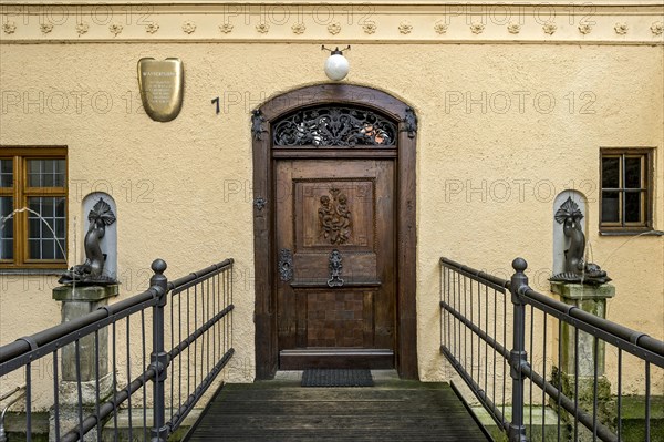 Entrance with two bronze dolphins