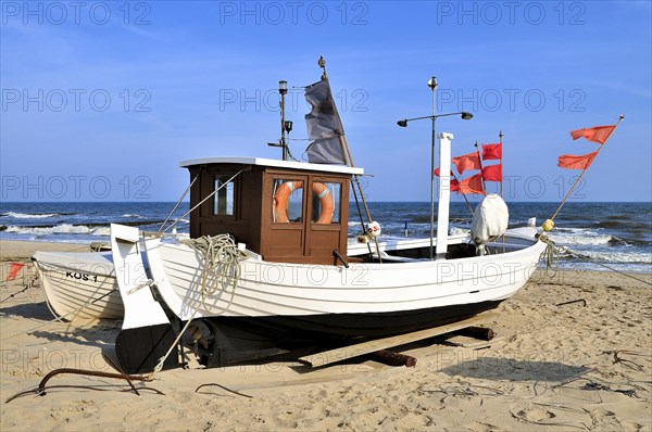 Fishing boat with red marker flags