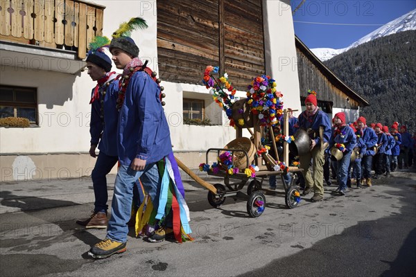 Parade of school boys with big bells