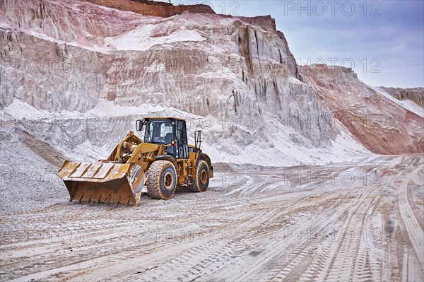 Shovel excavator in kaolin pit