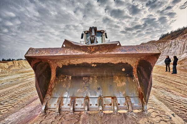 Shovel excavator in kaolin pit